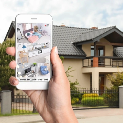 Burlington vivint phone display of cctv live feed in front of a house